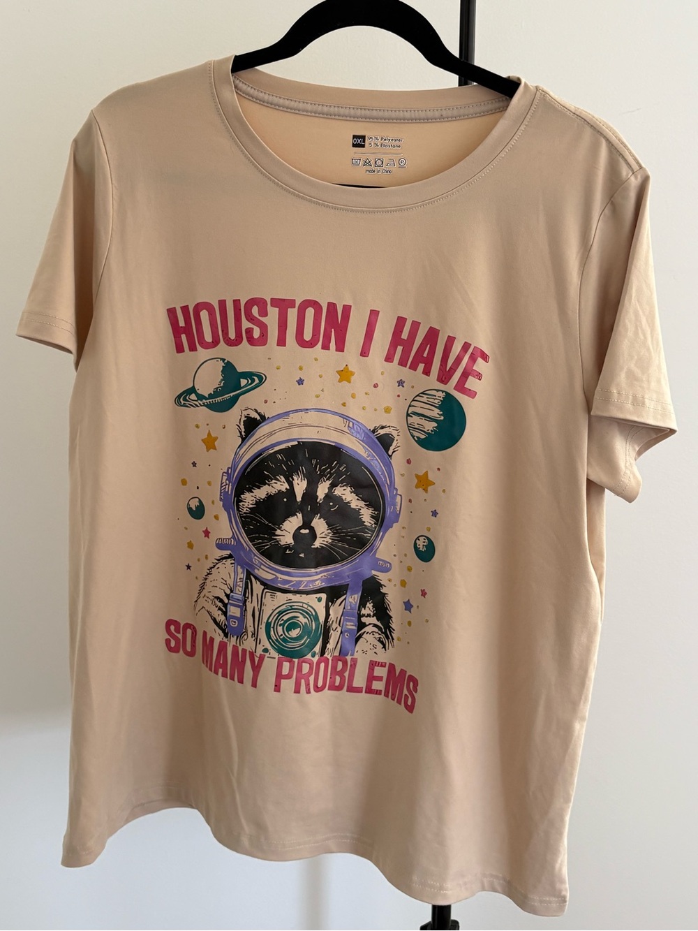 Graphic Raccoon Astronaut Tee - Beige with Pink & Teal Print